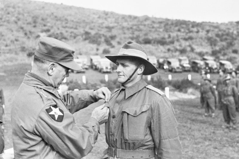 Image: Australian War Memorial | Solider from 3RAR received the US Presidential Distinguished Unit Citation Device from General James Van Fleet, Commanding Officer of the 8th US Army in Korea.