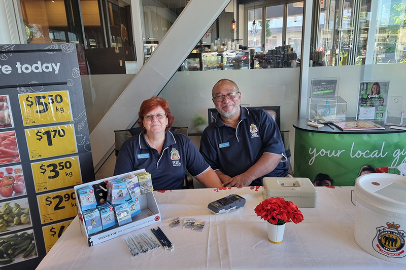 John and Naomi Enchong sitting at a table