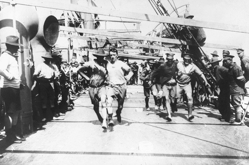 Members of the AIF participate in a three-legged race aboard the SS Port Nicholson in 1916. Photo: Australian War Memorial