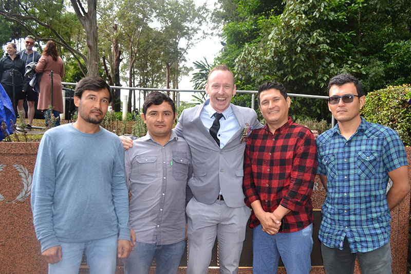 Image: Tamborine Times - Afghan refugees now living in Brisbane with Tim Salau (center) from the Community Refugees Sponsorship Program