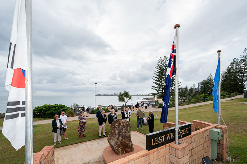 Veteran's family in front of korean war memorial