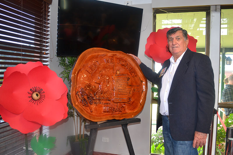 Image: Tamborine Times - Greg Rose with a memorial plaque he made for his father, World War II veteran Jack (JA) Rose.