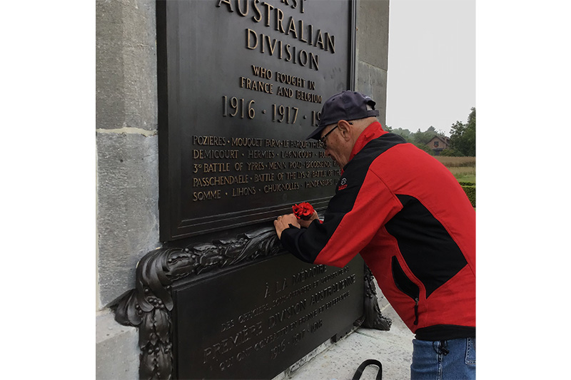 Kalbar RSL Sub Branch member Stephen Pace lays poppies at the AIF First Division Memorial at Poziers, France. 