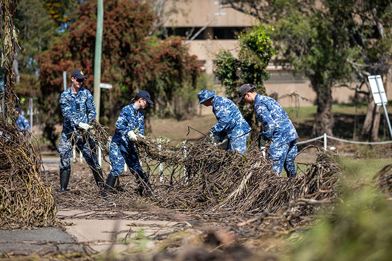 ANZAC Spirit RAAF members help clean up a park after recent flooding