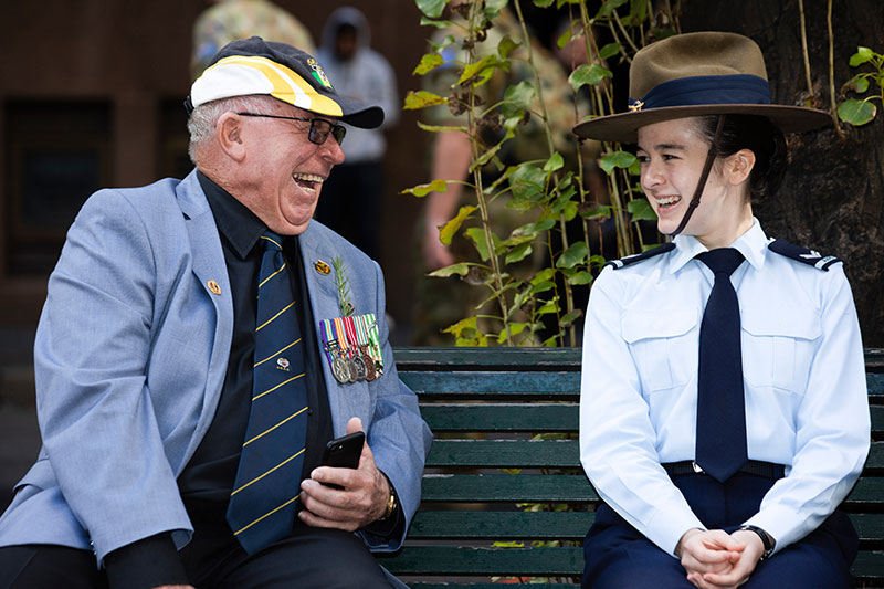 ANZAC Spirit veteran shares a laugh with an Air Force Cadet